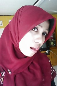 malay wife with kain batik and hijab